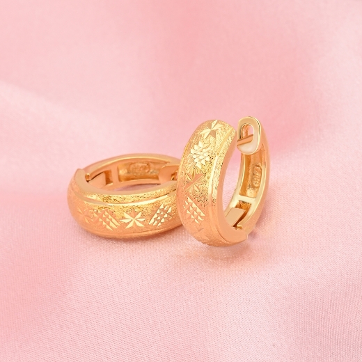 gold plated textured star earrings