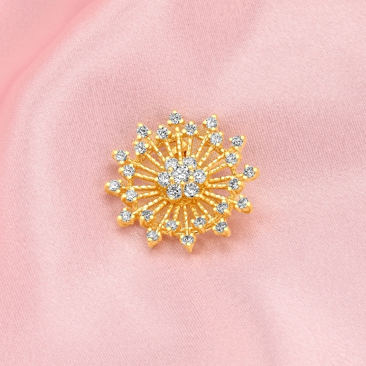 small sunburst gold plated brooch